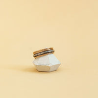 minimal-style ring on a clay ring holder
