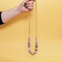 model holding Lilac Stone and Fishbone Chain Necklace 