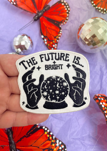 Model holding The Future Is Bright Iron On Patch