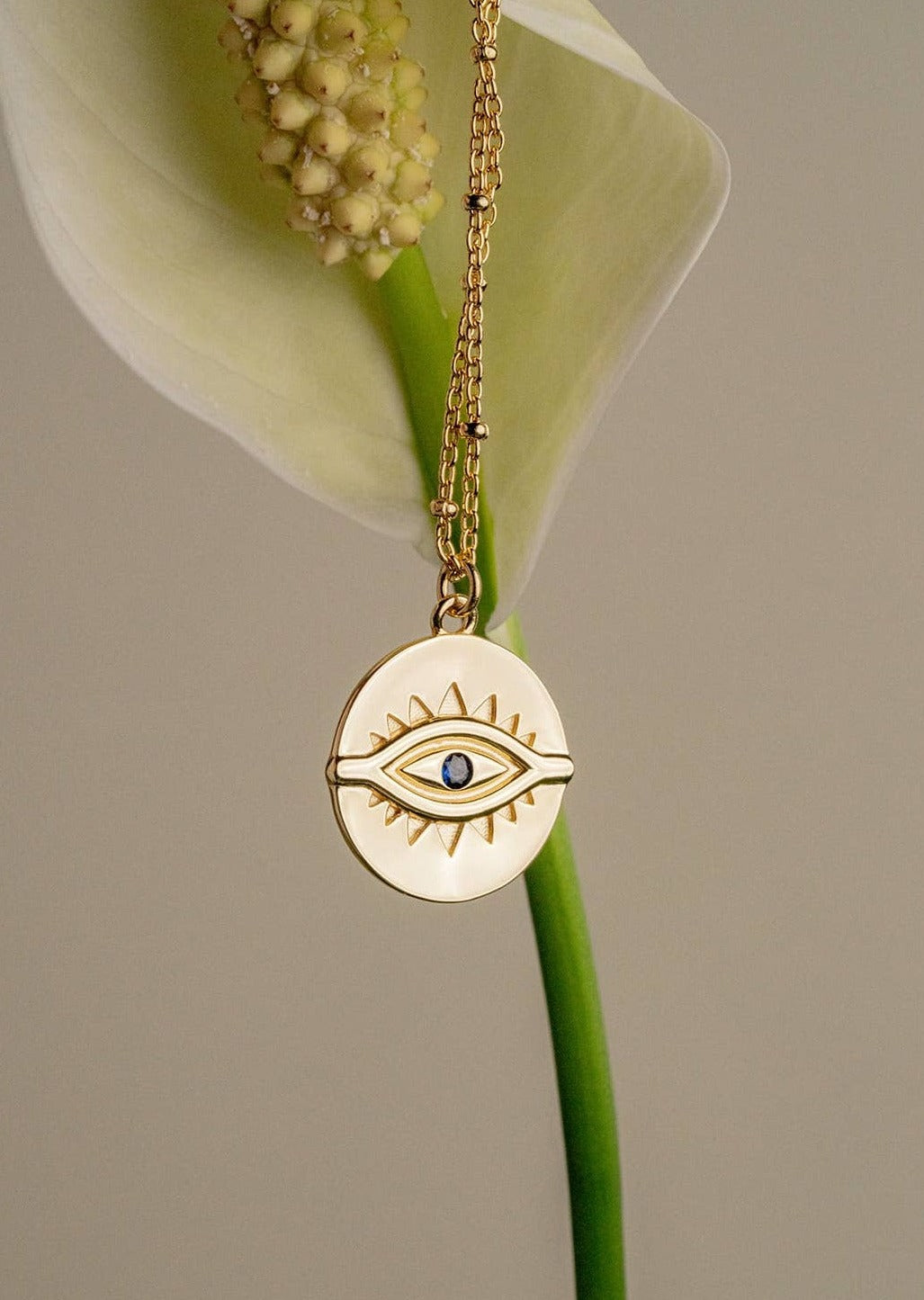 Blue Sapphire Evil Eye Pendant Necklace on a Flower Stem
