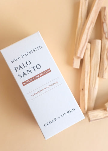 palo santo sticks on the right with the box in center